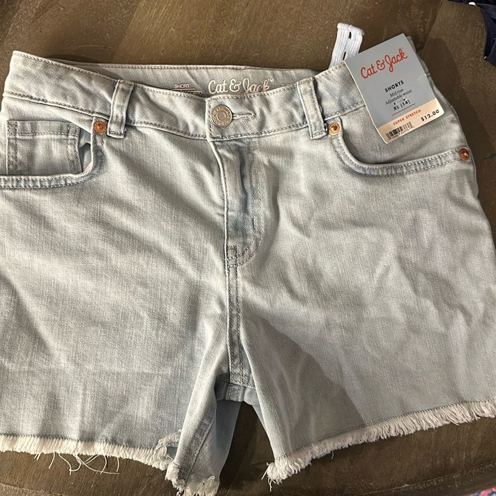 Cute cat and Jack denim shorts. NWT size 14